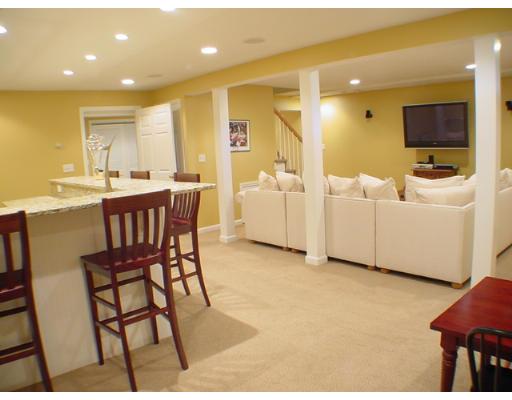 1 Stoneybrook Road Grafton, MA 01536 - Photo 21 of 30 a view of a dining room with furniture and a flat screen tv