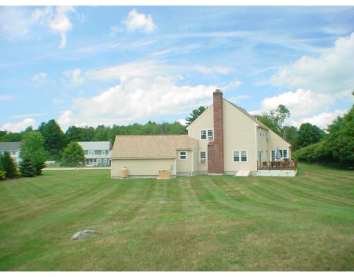 1 Stoneybrook Road Grafton, MA 01536 - Photo 27 of 30 a white house with a big yard and large trees with wooden fence