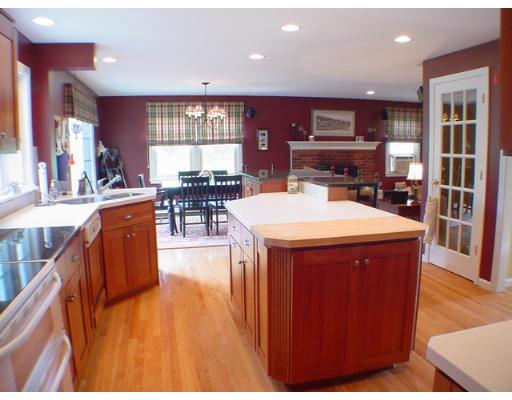 1 Stoneybrook Road Grafton, MA 01536 - Photo 3 of 30 a kitchen with stainless steel appliances kitchen island granite countertop a table chairs and a refrigerator