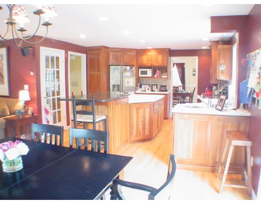 1 Stoneybrook Road Grafton, MA 01536 - Photo 4 of 30 a view of a living room and kitchen