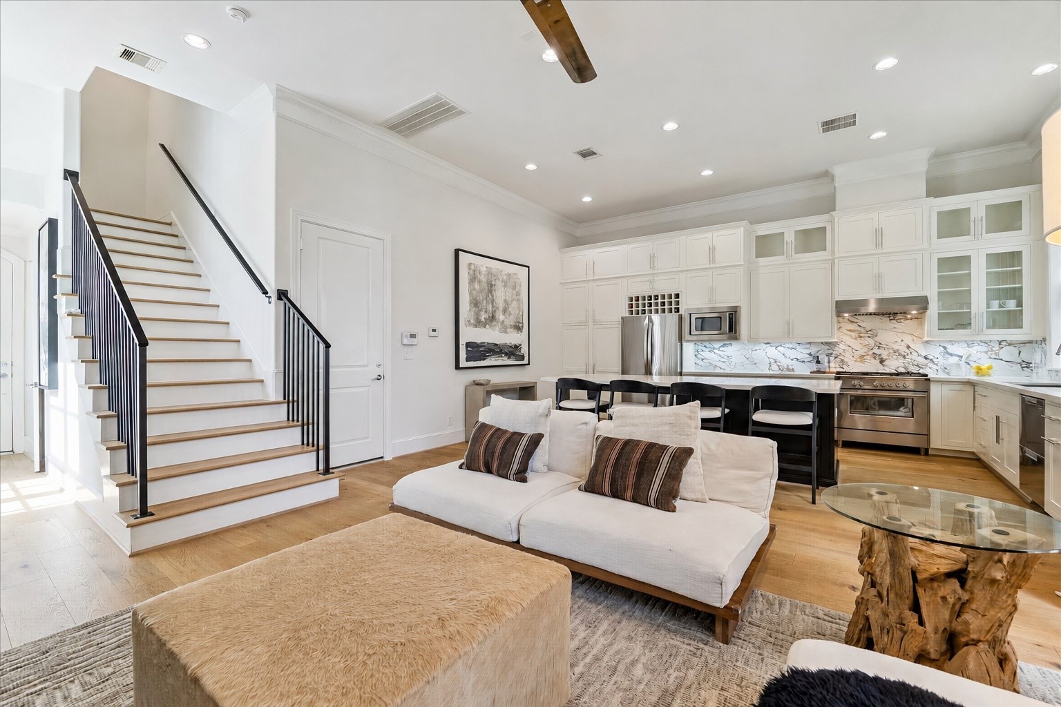 6108 Nicholas Grove Place Houston, TX 77055 - Photo 9 of 29 A thoughtful seller upgrade, the custom iron handrails add character, sophistication, and a refined finishing touch to the space.