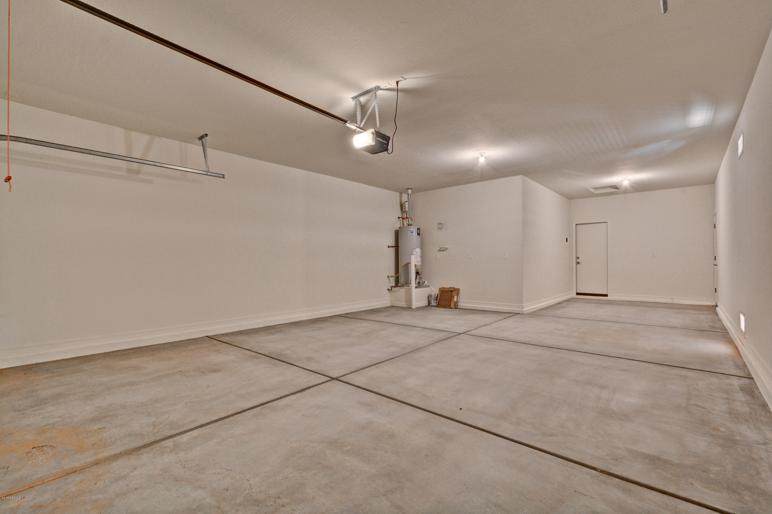 16746 West Rowel Road Surprise, AZ 85387 - Photo 13 of 35 3 Car Tandem Garage - Lot 4 The Palms