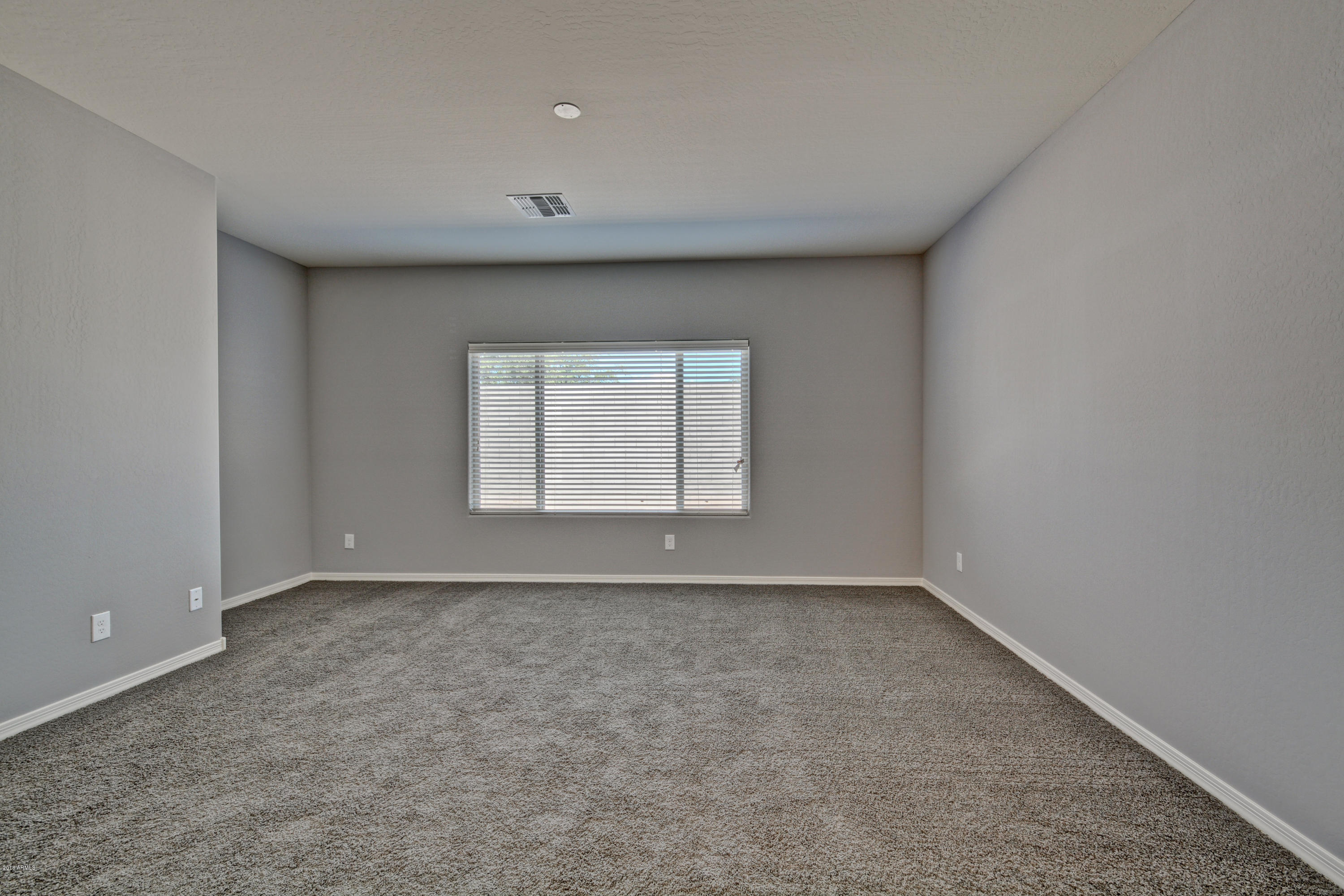 16746 West Rowel Road Surprise, AZ 85387 - Photo 26 of 35 a view of an empty room with a window