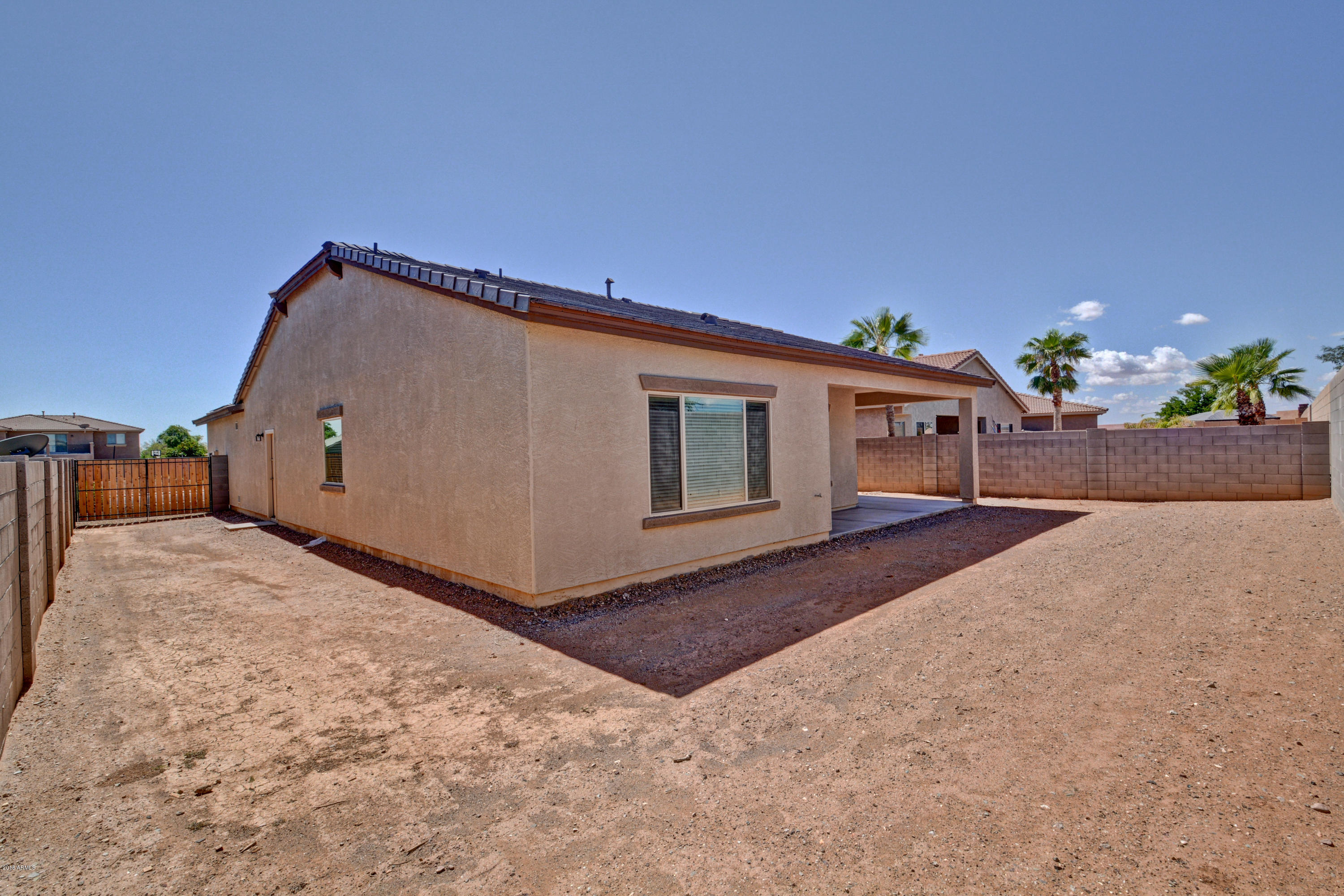 16746 West Rowel Road Surprise, AZ 85387 - Photo 33 of 35 a view of a house with a backyard