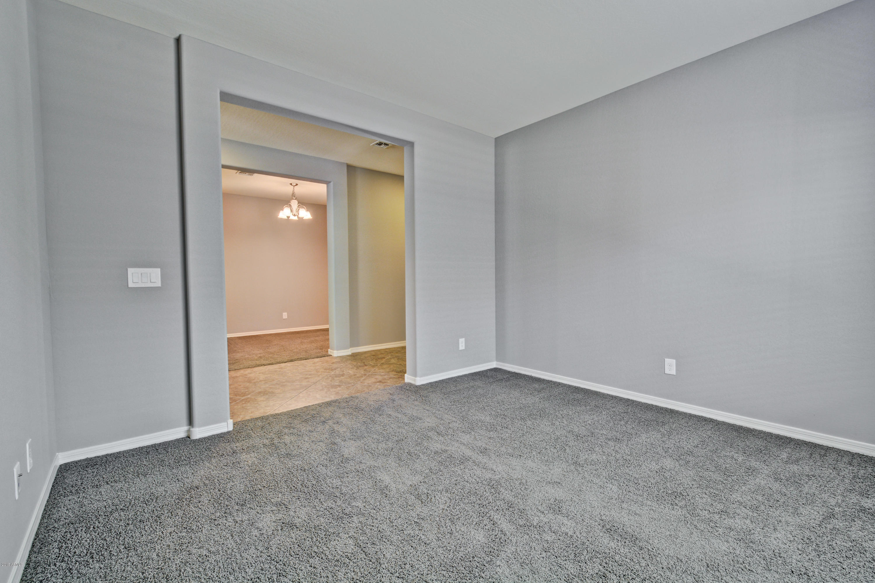 16746 West Rowel Road Surprise, AZ 85387 - Photo 10 of 35 a view of an empty room and closet area