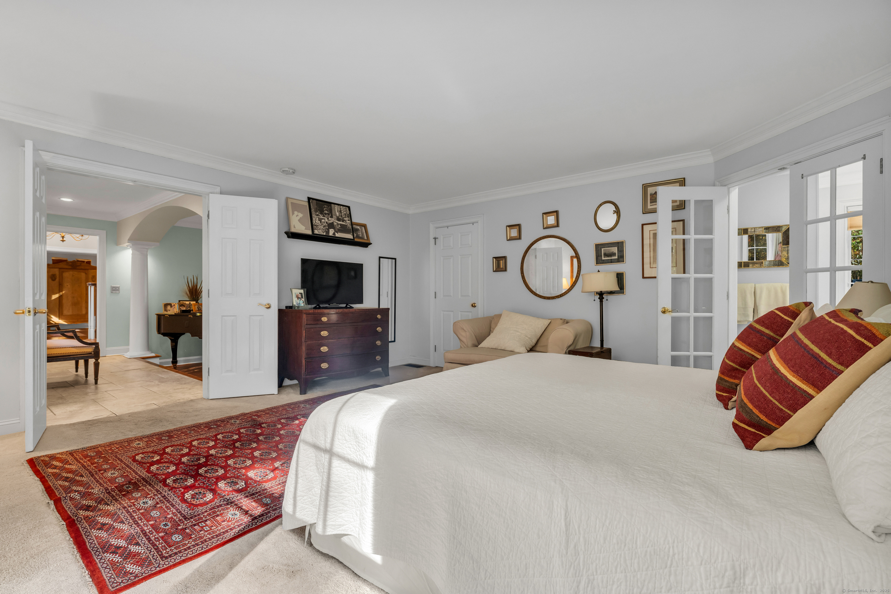 214 Nortontown Road Guilford, CT 06437 - Photo 21 of 40 a bed room with a bed and a television