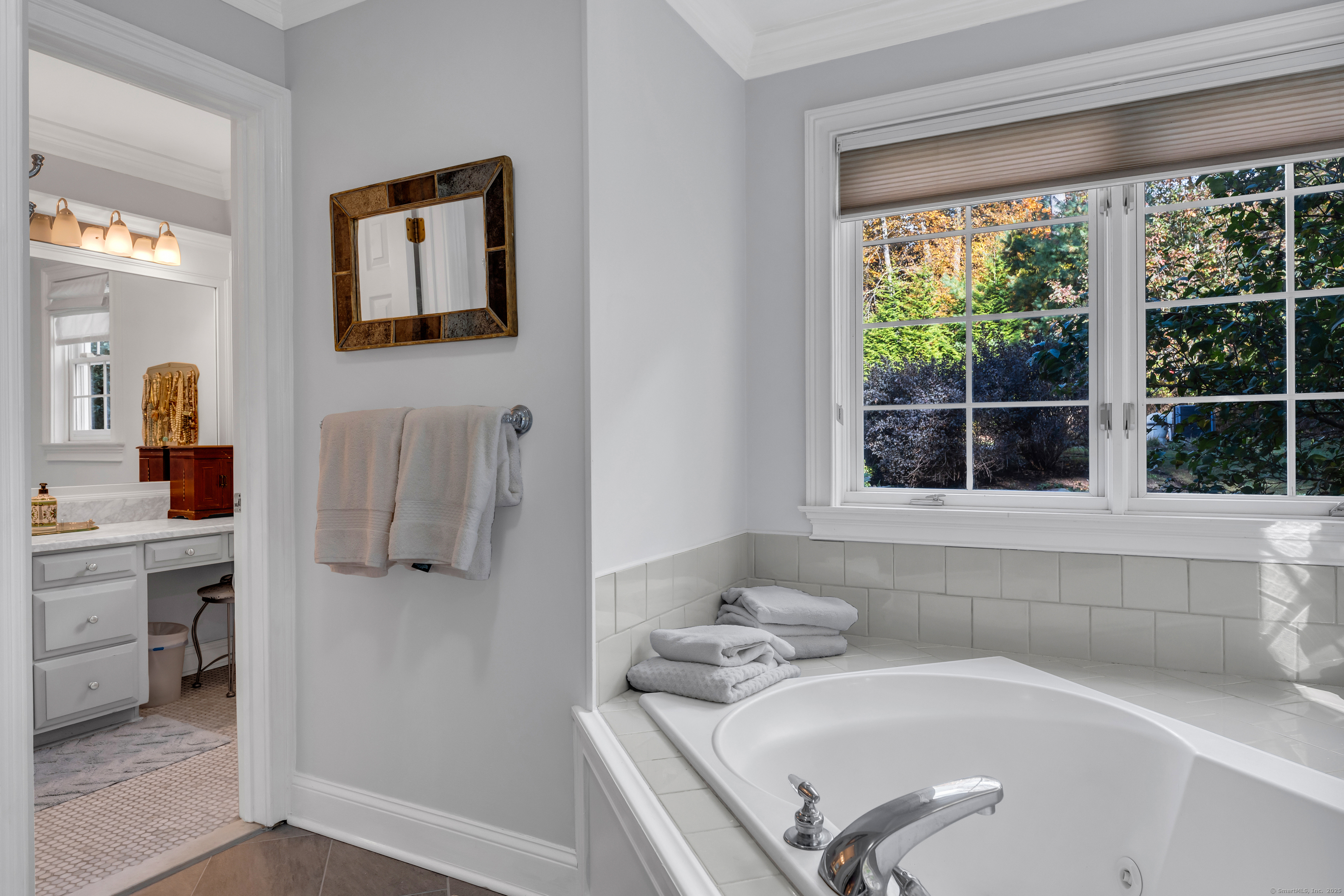 214 Nortontown Road Guilford, CT 06437 - Photo 23 of 40 a bathroom with a tub sink and mirror