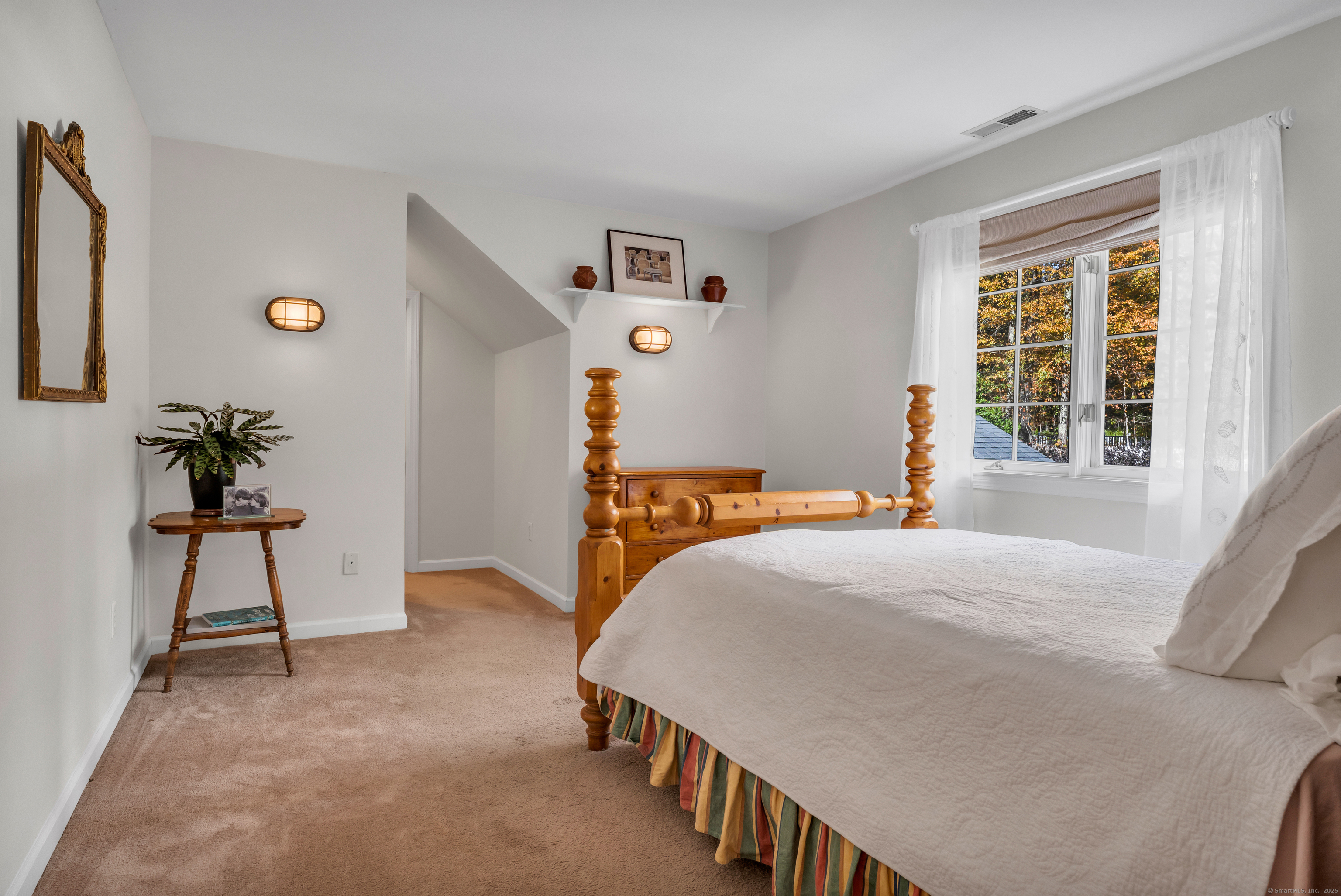 214 Nortontown Road Guilford, CT 06437 - Photo 28 of 40 a bedroom with a bed and a window