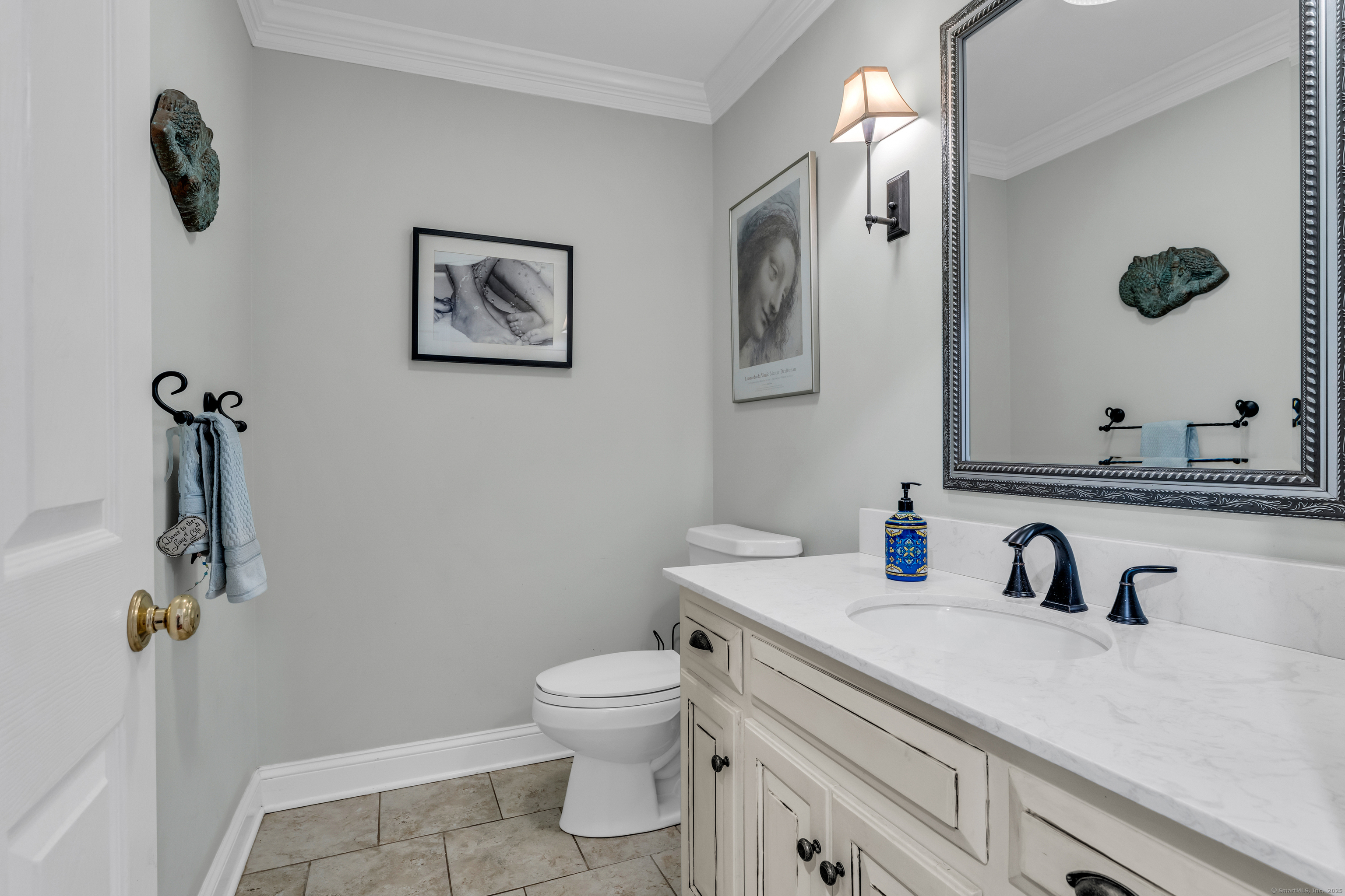 214 Nortontown Road Guilford, CT 06437 - Photo 8 of 40 a bathroom with a sink mirror vanity and toilet