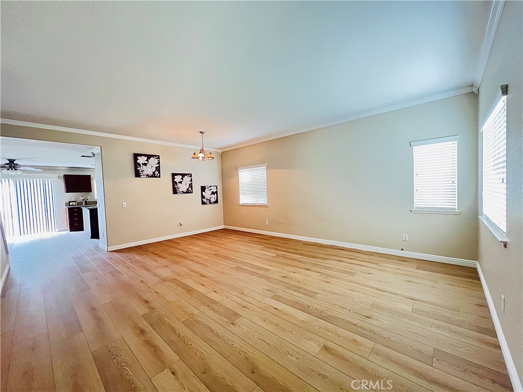 12270 Mesa Grove Drive Riverside, CA 92503 - Photo 3 of 41 a view of empty room with wooden floor and fan