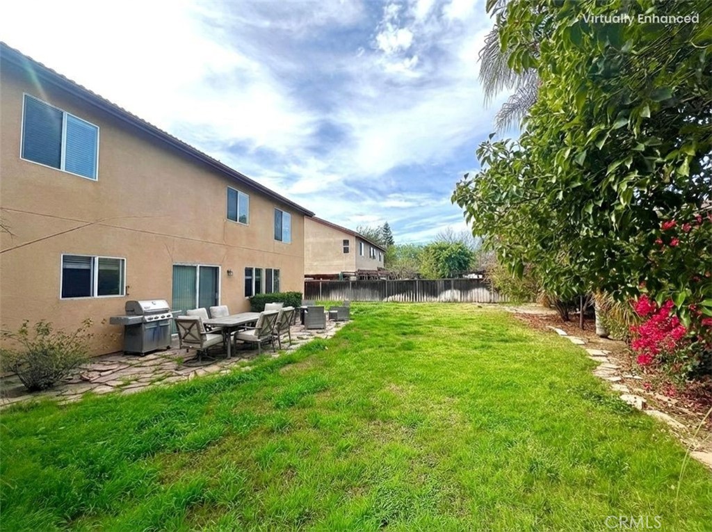 12270 Mesa Grove Drive Riverside, CA 92503 - Photo 38 of 41 a backyard of a house with table and chairs