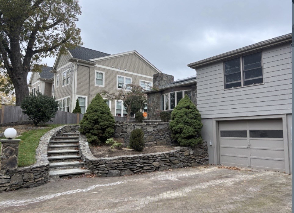 338 Langley Road Newton, MA 02459 - Photo 1 of 18 a front view of a house with a yard