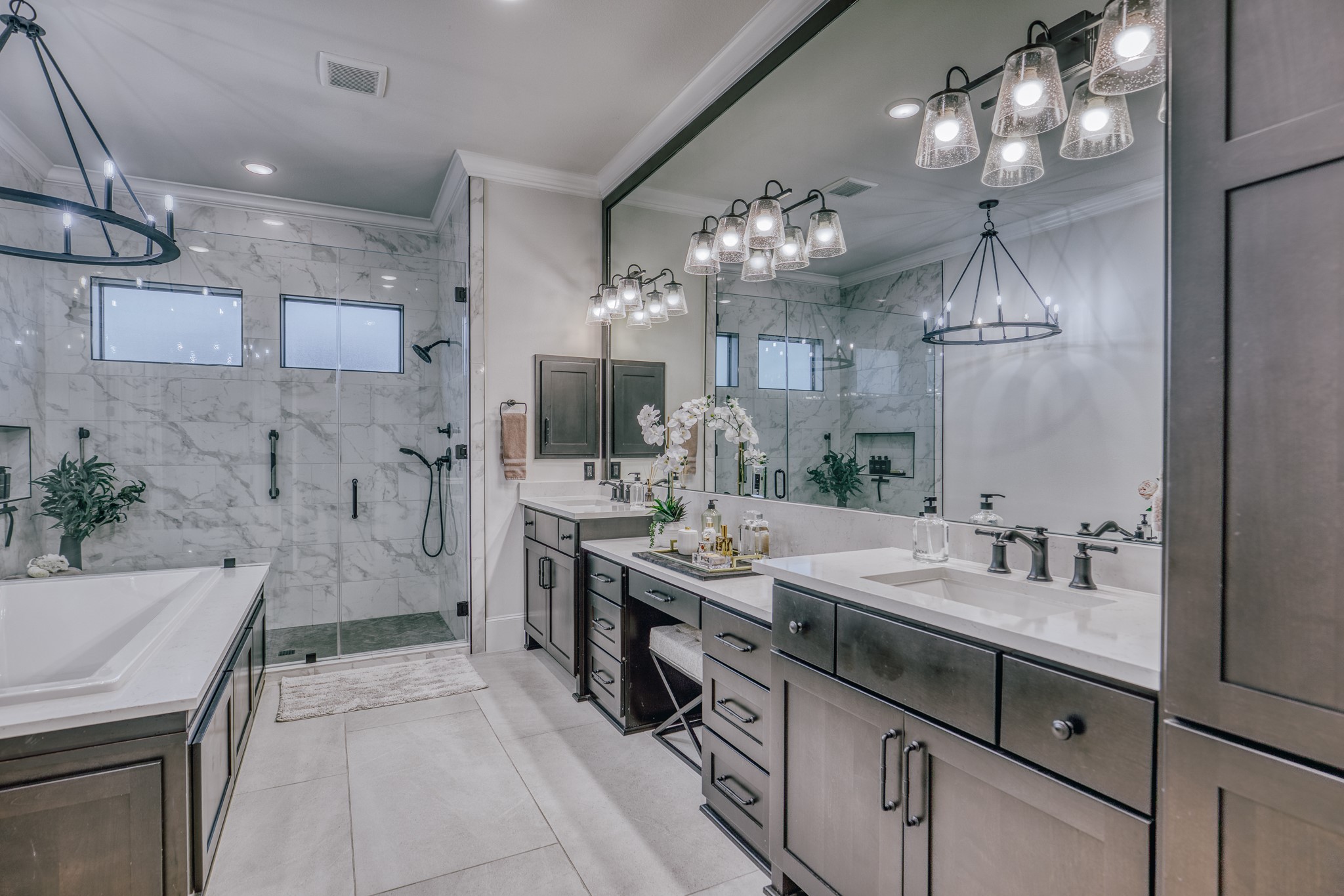1034 Hilbun Road New Ulm, TX 78950 - Photo 24 of 49 Luxurious primary bath featuring dual vanities, soaking tub, oversized marble-clad shower, premium finishes, and a spa-inspired design created for everyday comfort and relaxation.