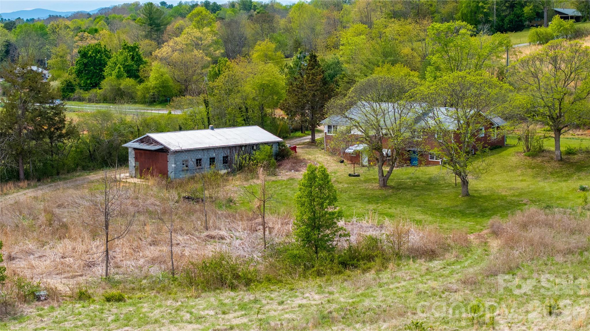 1720 Cane Creek Road Fletcher, NC 28732 - Photo 14 of 20 a view of a lake with a yard