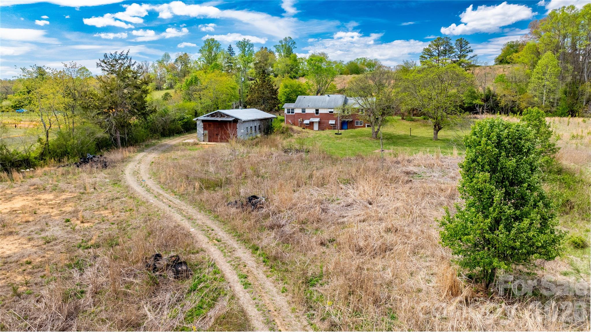 1720 Cane Creek Road Fletcher, NC 28732 - Photo 16 of 20 a backyard of a house with a yard and outdoor seating
