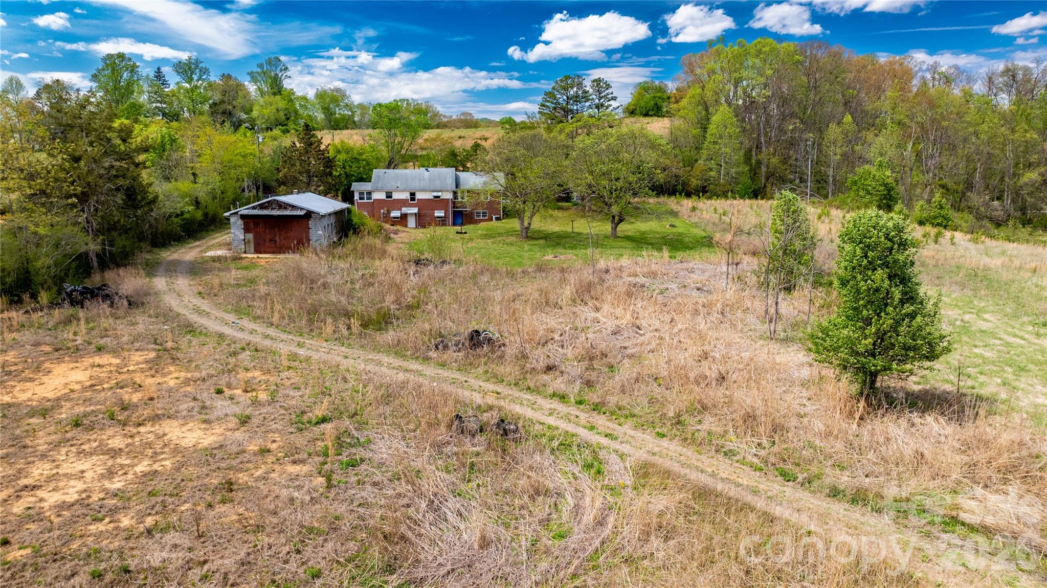 1720 Cane Creek Road Fletcher, NC 28732 - Photo 17 of 20 a view of a garden with a houses