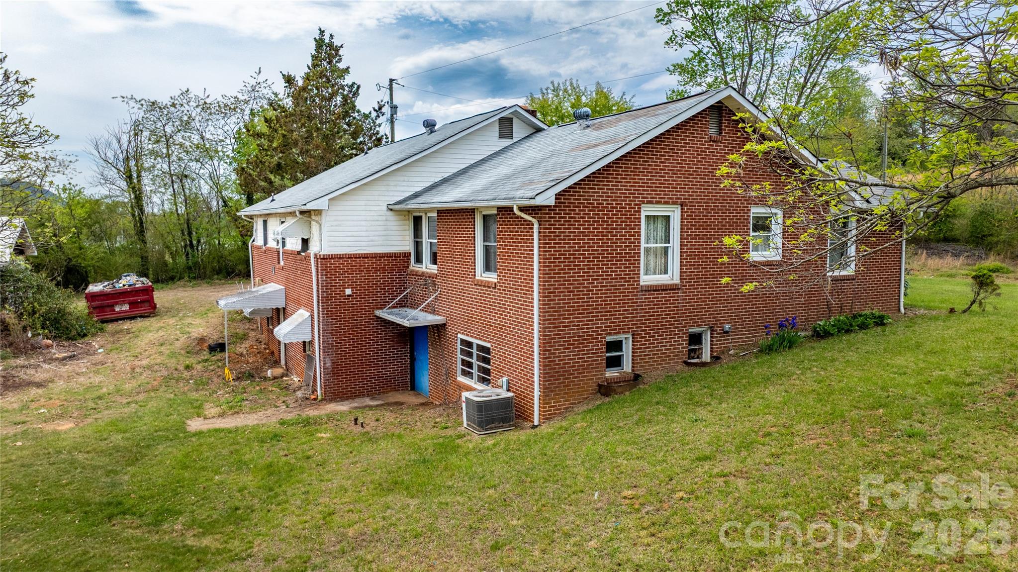 1720 Cane Creek Road Fletcher, NC 28732 - Photo 2 of 20 a view of backyard of house with wooden fence and a large tree
