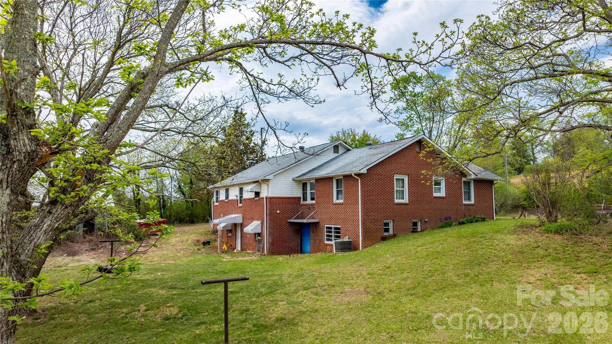 1720 Cane Creek Road Fletcher, NC 28732 - Photo 3 of 20 a view of a house with a yard