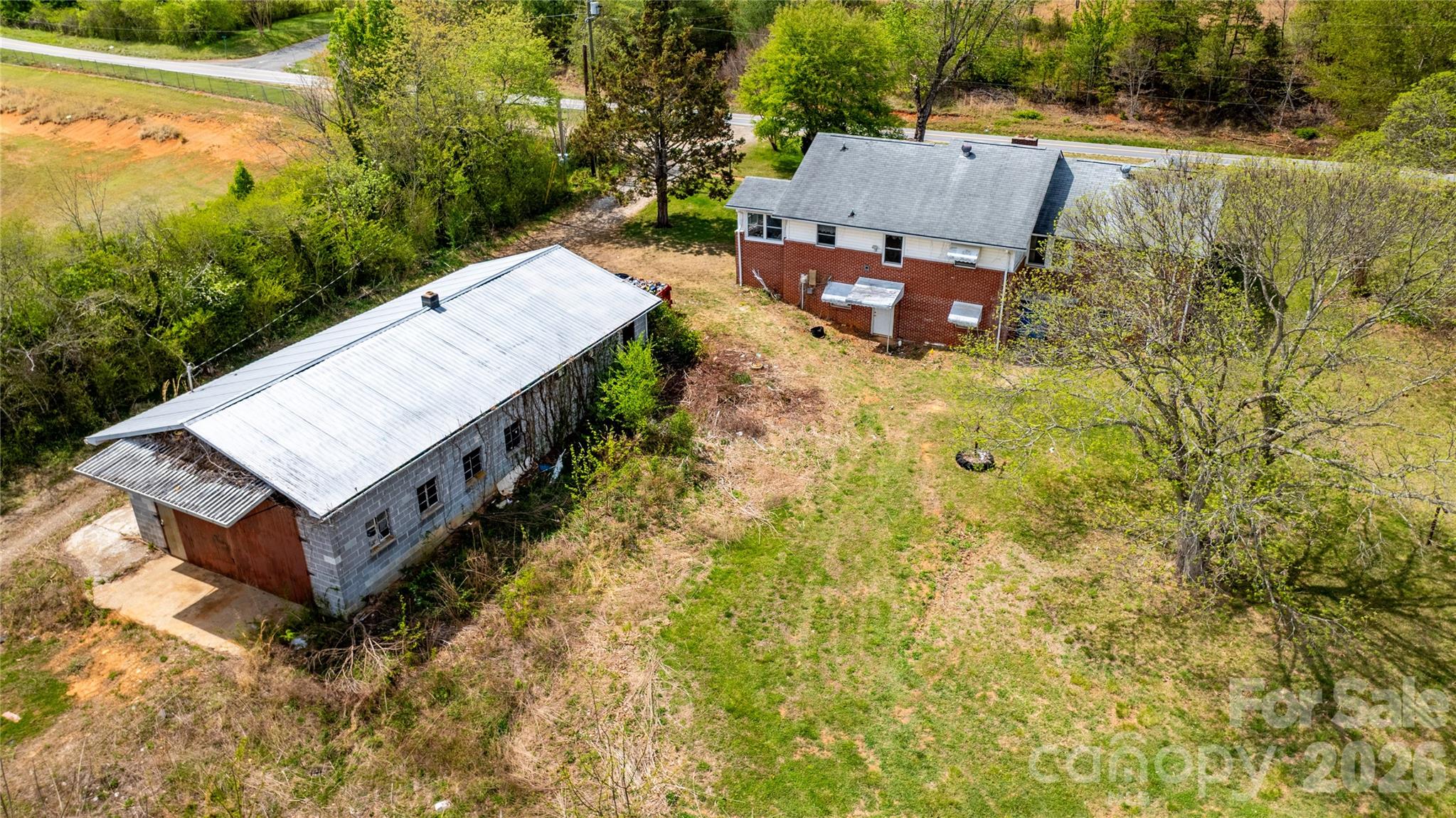 1720 Cane Creek Road Fletcher, NC 28732 - Photo 5 of 20 an aerial view of a house with a yard and a large tree