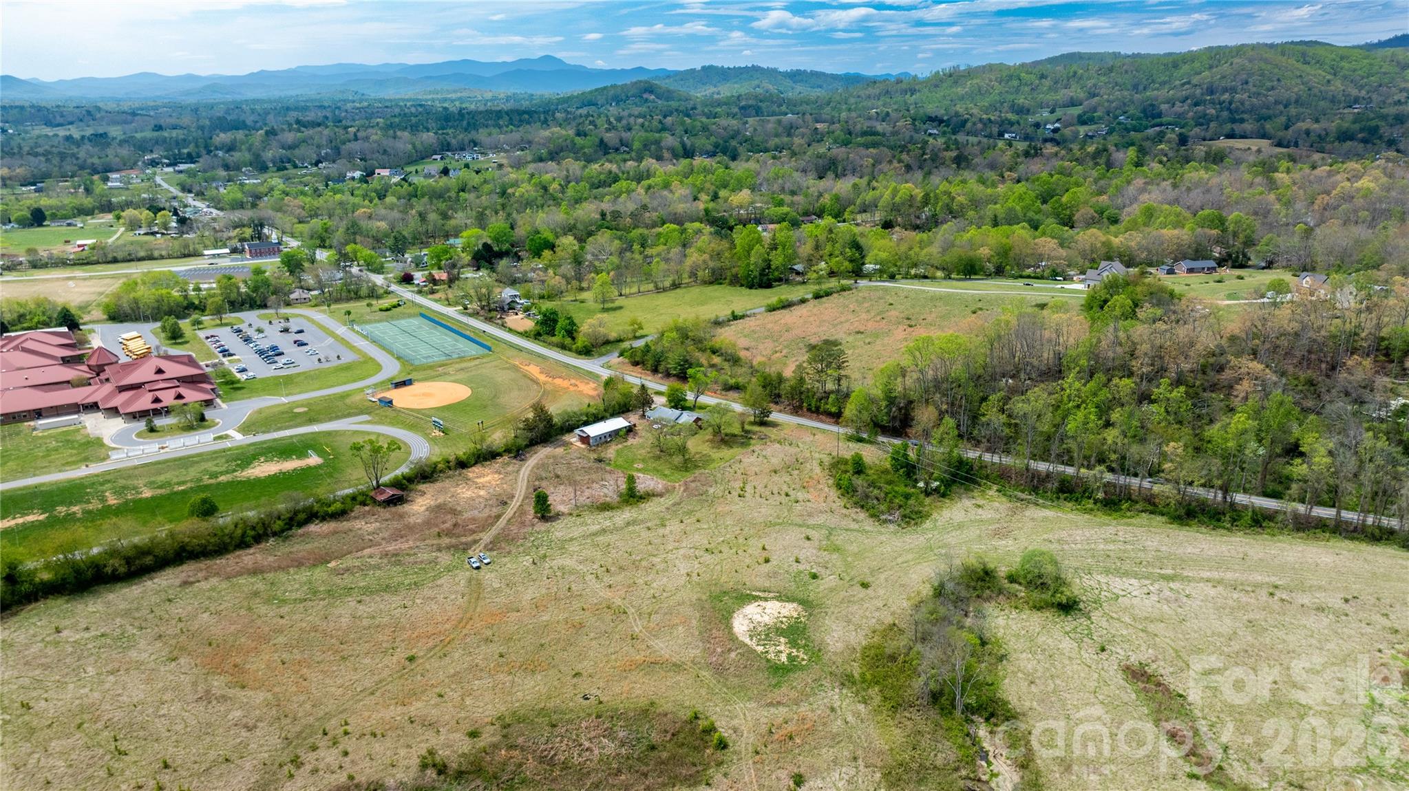 1720 Cane Creek Road Fletcher, NC 28732 - Photo 7 of 20 a view of a lush green field