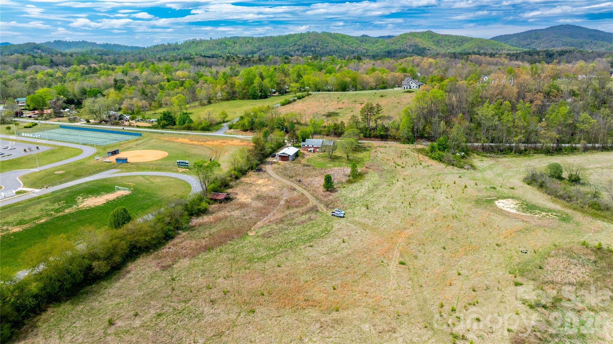 1720 Cane Creek Road Fletcher, NC 28732 - Photo 8 of 20 a view of a lake with a yard