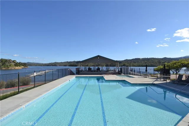 a view of a swimming pool with lounge chair