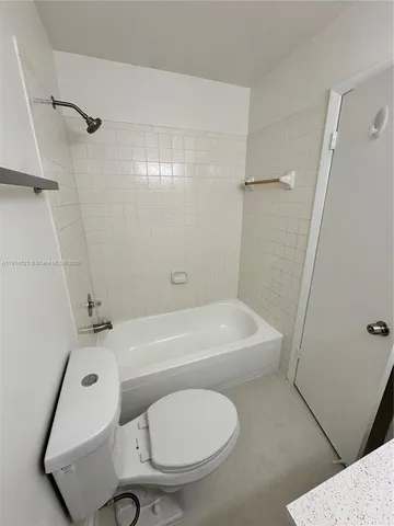 a bathroom with a sink toilet and a mirror