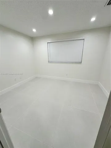 a view of entryway and hall with a window