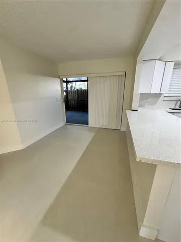 a view of kitchen and a sink