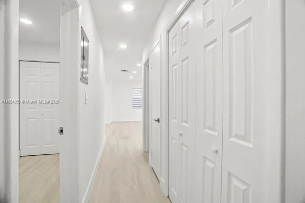 a view of a bathroom from a hallway