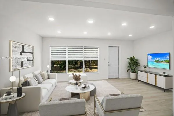 a living room with furniture and a large window