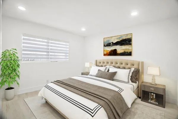 a bedroom with a bed and a painting on the wall