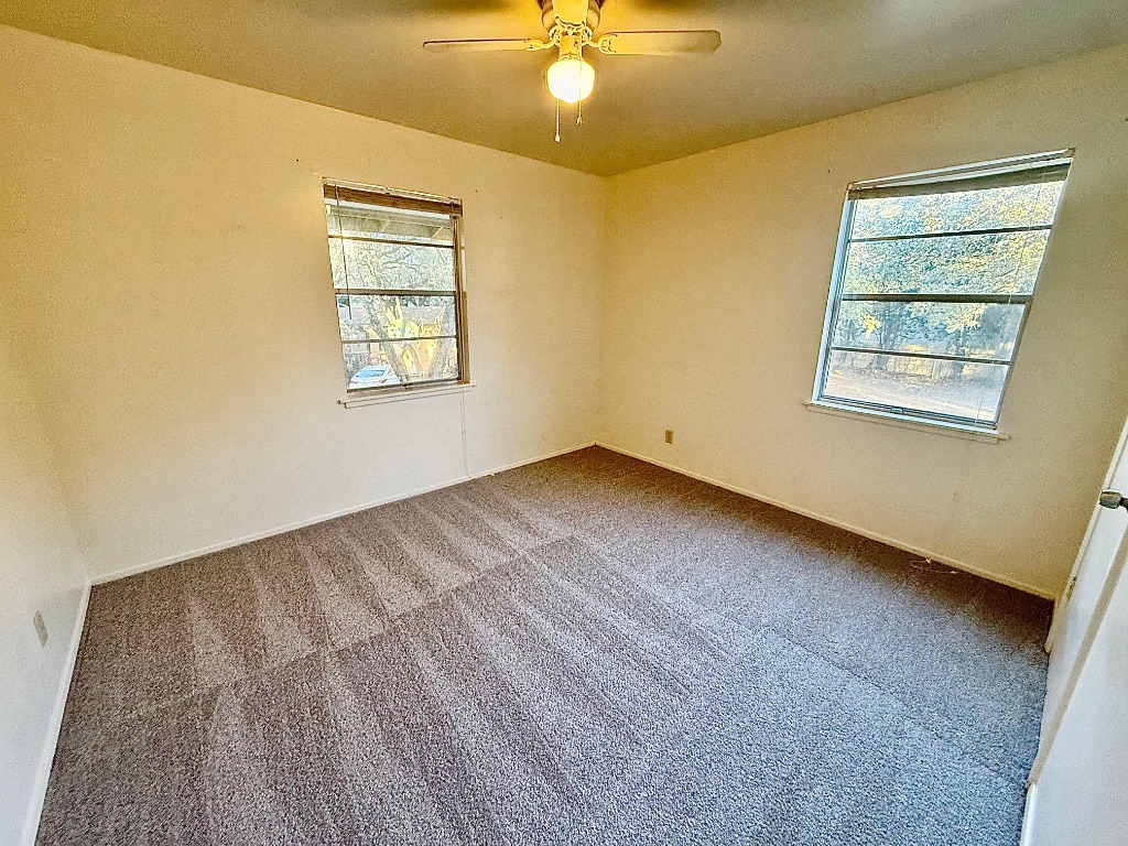 2411 South 5th Street, Unit 6 Austin, TX 78704 - Photo 6 of 17 a view of an empty room with a window