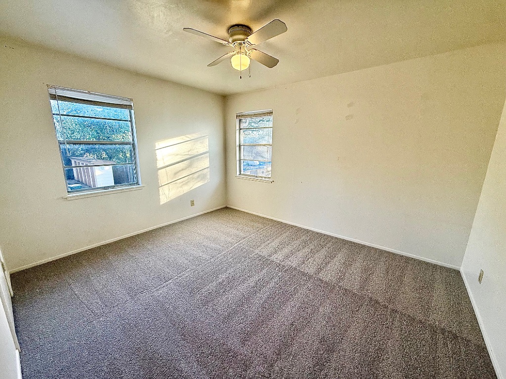 2411 South 5th Street, Unit 6 Austin, TX 78704 - Photo 9 of 17 a view of an empty room with a window