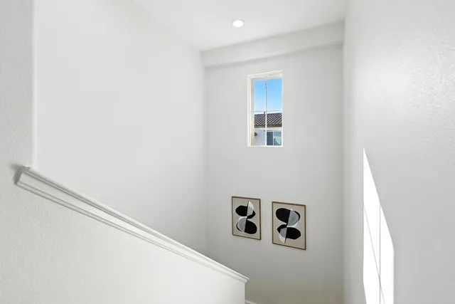 a white wall with window in it