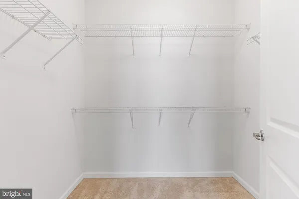 a view of a room with racks on the wall