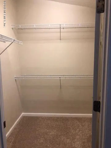 a view of a room with racks on the wall