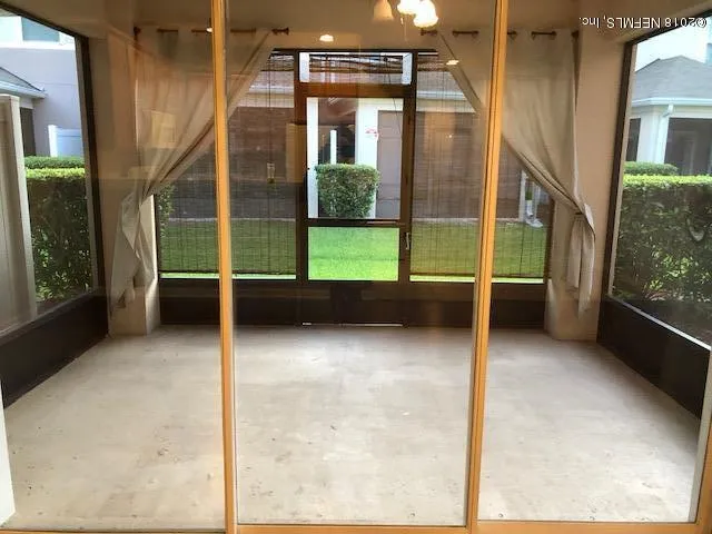 a view of an entryway with a floor to ceiling window