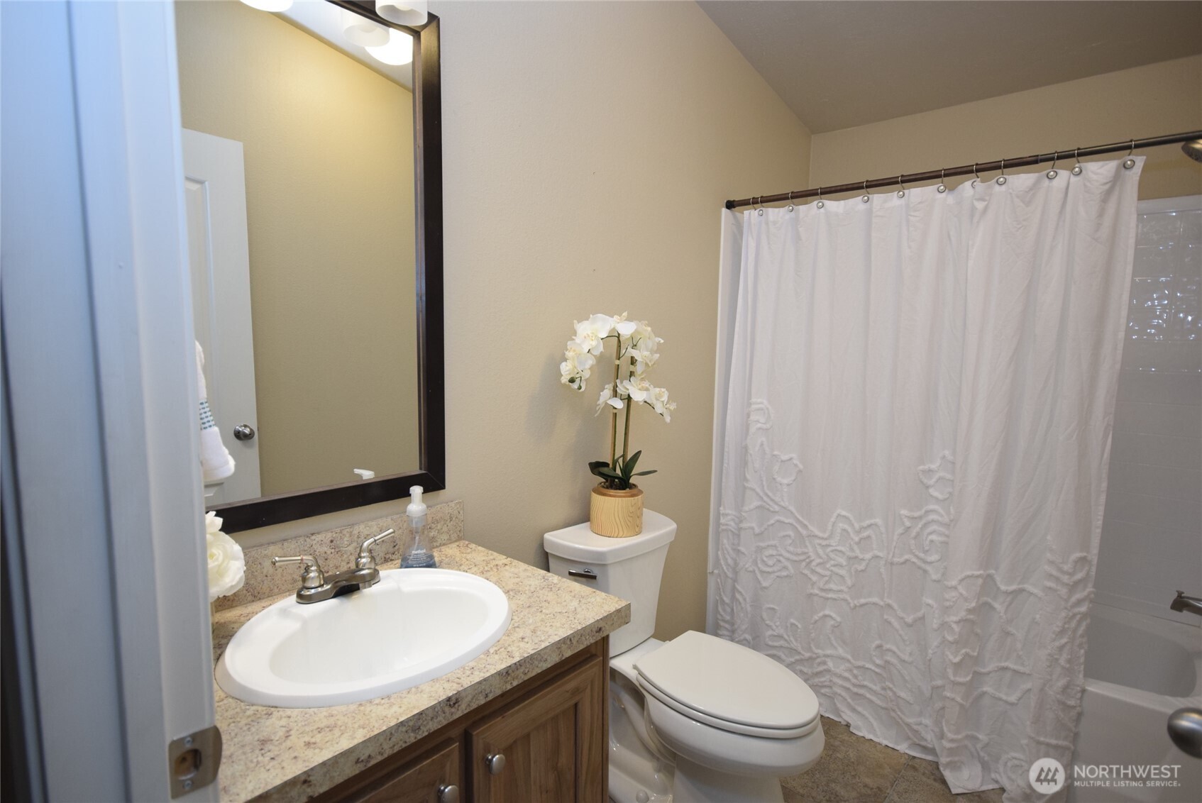 375 Dungeness Meadows Sequim, WA 98382 - Photo 15 of 27 a bathroom with a granite countertop sink toilet and a mirror