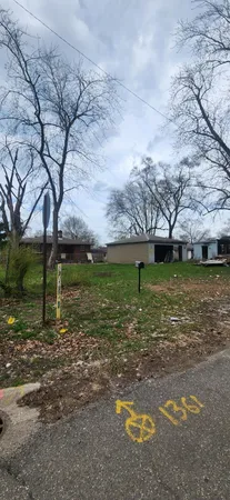 a view of a playground with a yard