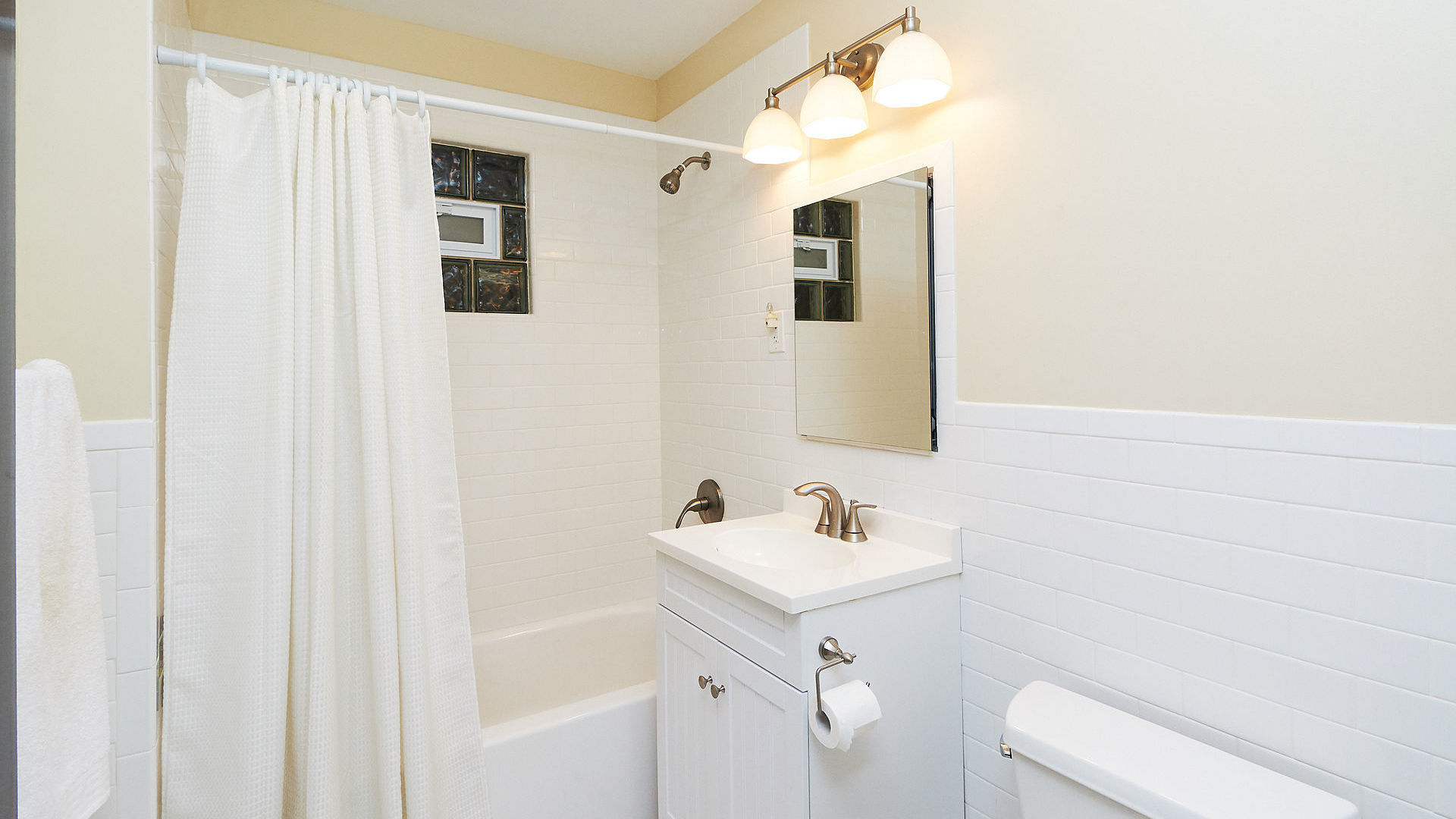 521 Jackson Boulevard, Unit A2 Forest Park, IL 60130 - Photo 4 of 4 a bathroom with a sink a toilet and shower