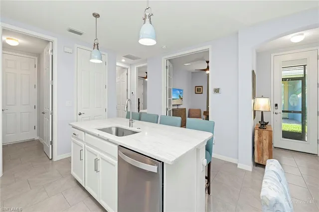 a kitchen with a dining table and chairs