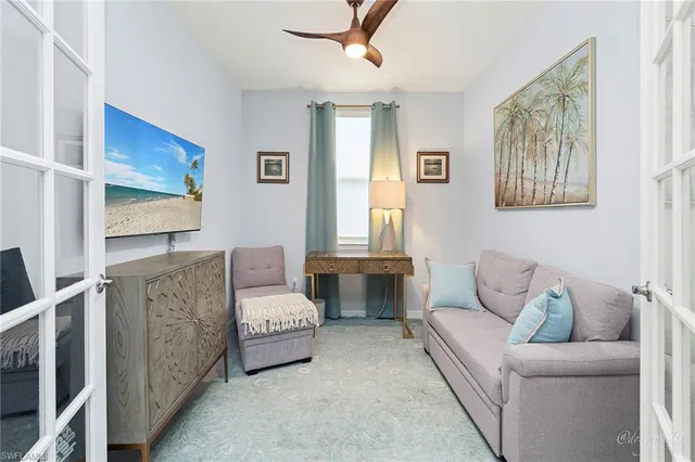 a bedroom with furniture and a chandelier