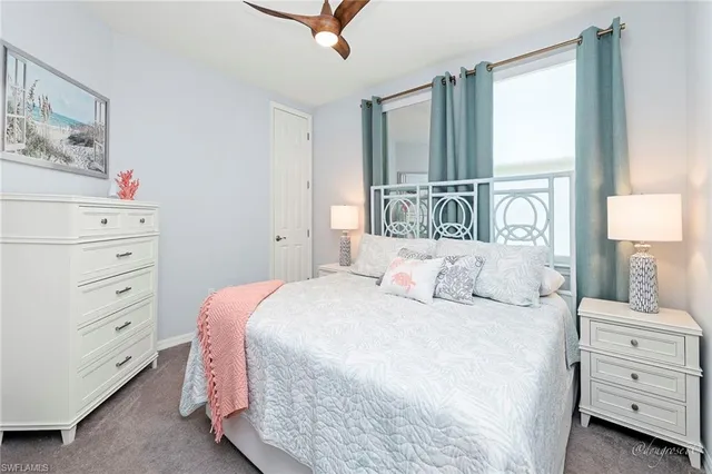 a bedroom with a bed and a cabinets