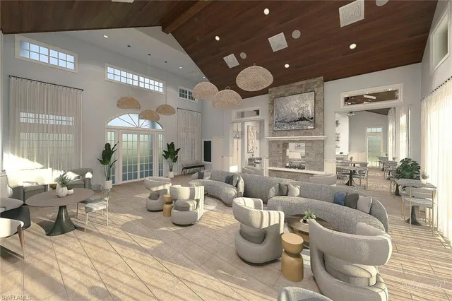 a living room with lots of furniture and a chandelier