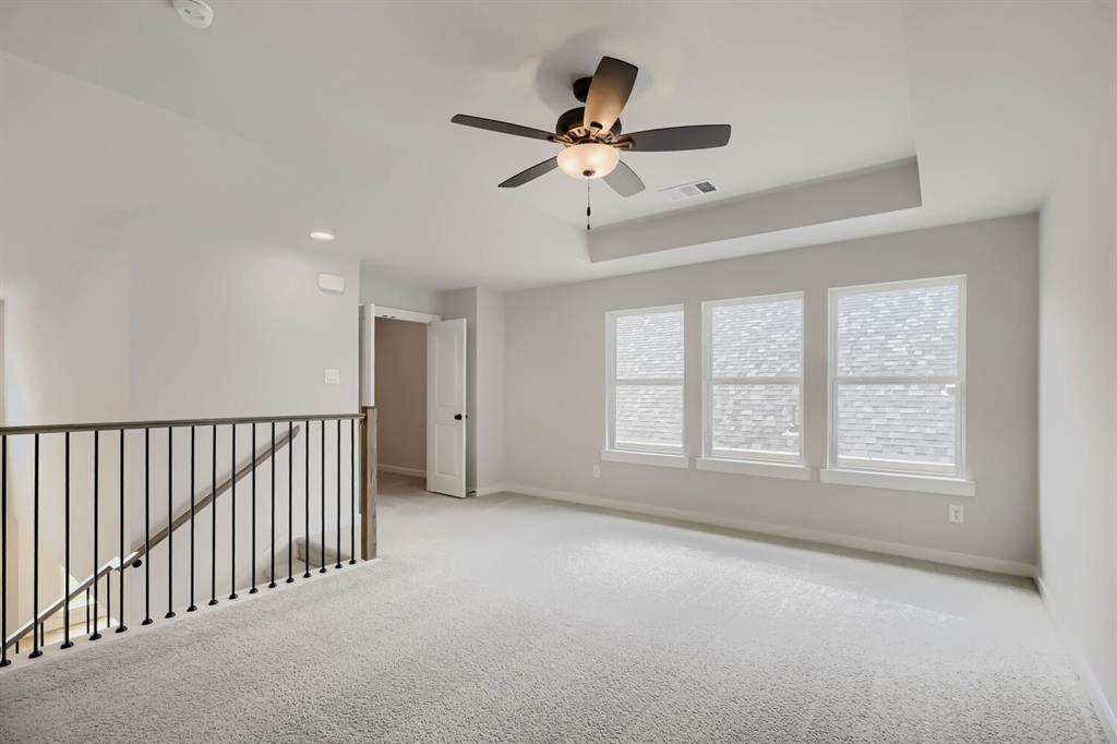 4414 Windy Point Road Oak Point, TX 75068 - Photo 5 of 27 a view of an empty room with a window
