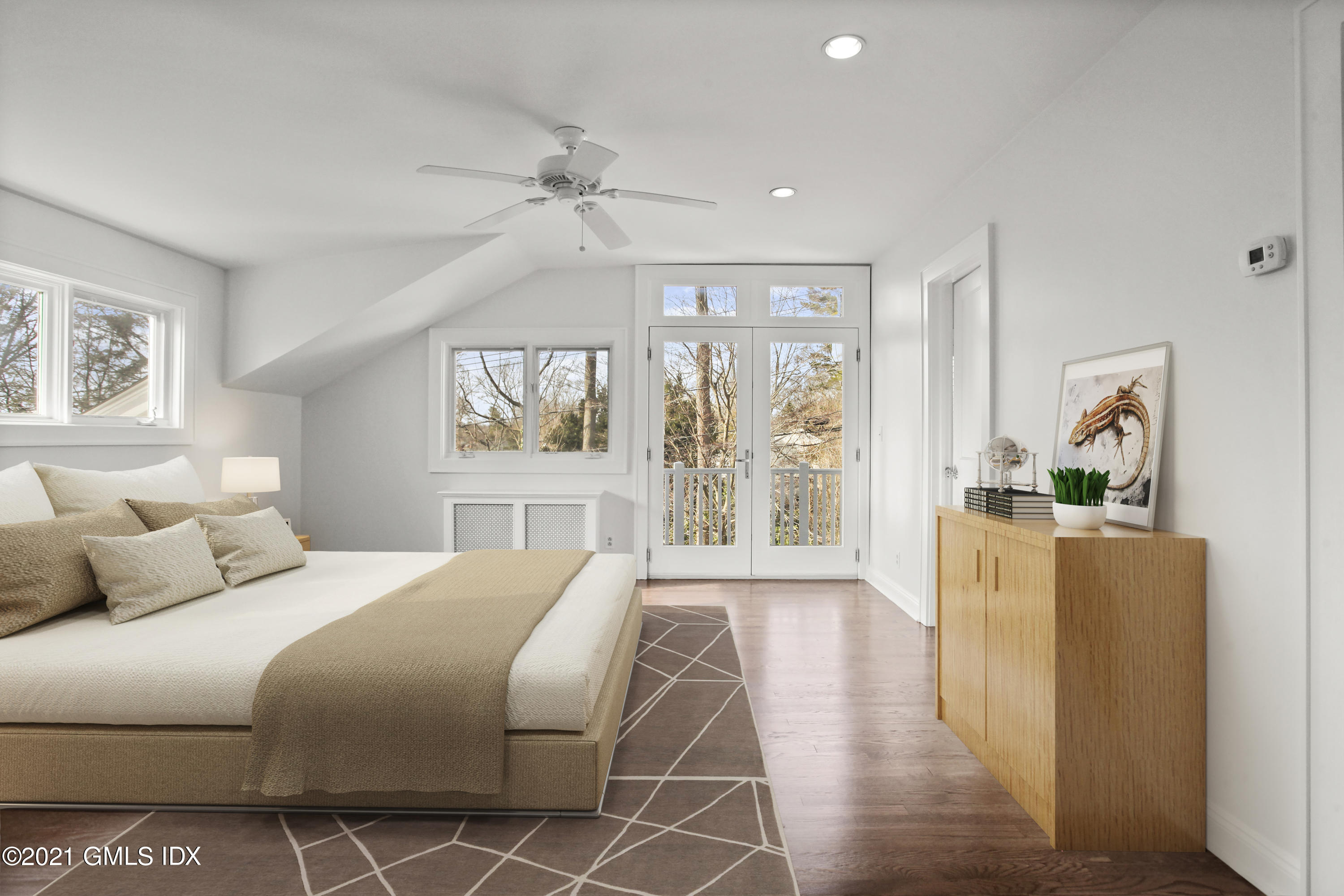 11 Chapel Lane Riverside, CT 06878 - Photo 21 of 33 a bedroom with a large bed and a large window