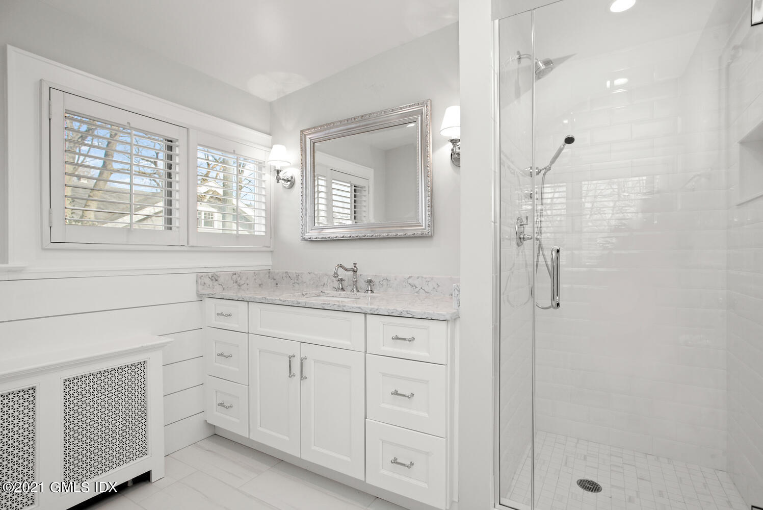 11 Chapel Lane Riverside, CT 06878 - Photo 22 of 33 a bathroom with a granite countertop sink a shower a window and a mirror