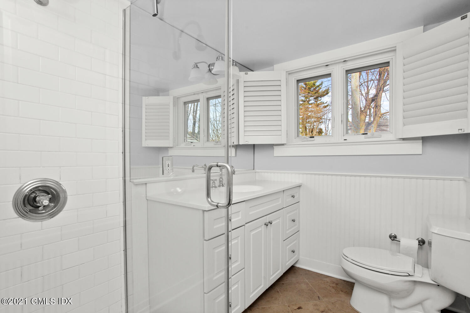11 Chapel Lane Riverside, CT 06878 - Photo 23 of 33 a bathroom with a sink a toilet and a window