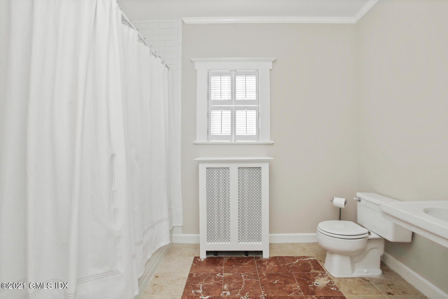 11 Chapel Lane Riverside, CT 06878 - Photo 27 of 33 a bathroom with a toilet a sink and a window